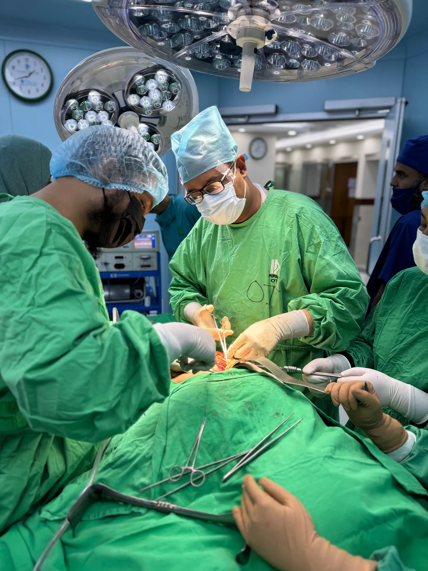 Dr. Arefin with the surgical team during a laparoscopic procedure