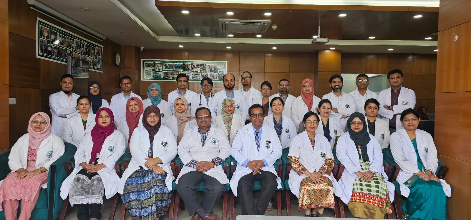 Dr. Arefin and medical staff reviewing patient liver health data